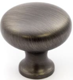 A round metal knob with a glossy finish, appearing dark in color with a hint of light reflecting on the surface.
